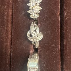 Several Silver Rings and a Coach Bracelet all Rings are size 9