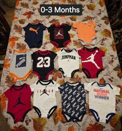 Jordan, Puma, and Nike Baby Onesies Lot - Size 0-3 Months
