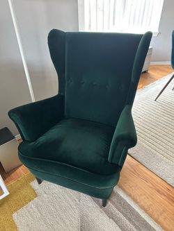 Dark green IKEA Strandmon wing chair