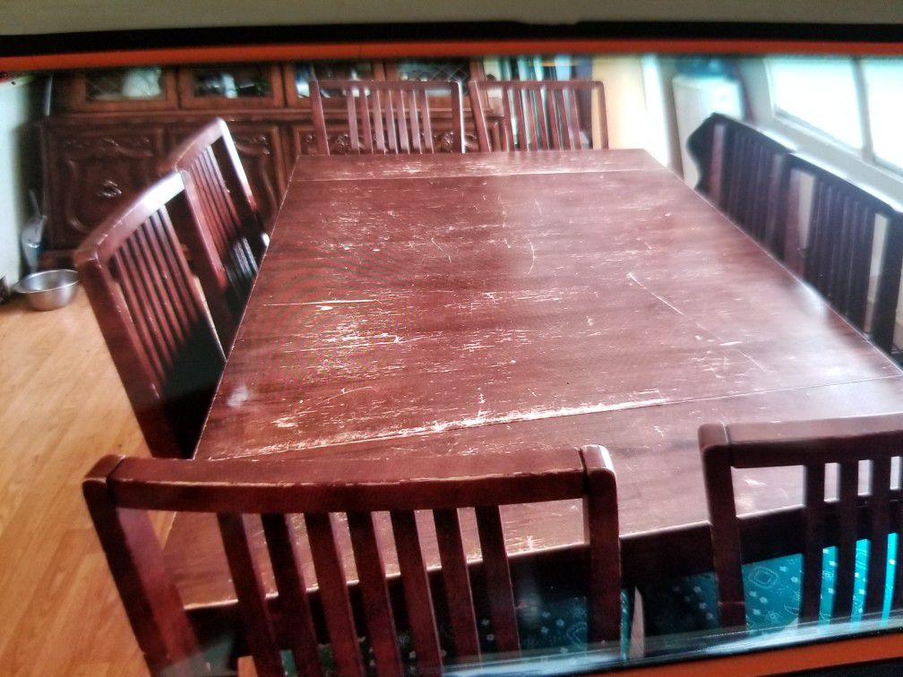 Dining room table with 8 matching chairs