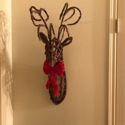 Buck with red ribbon