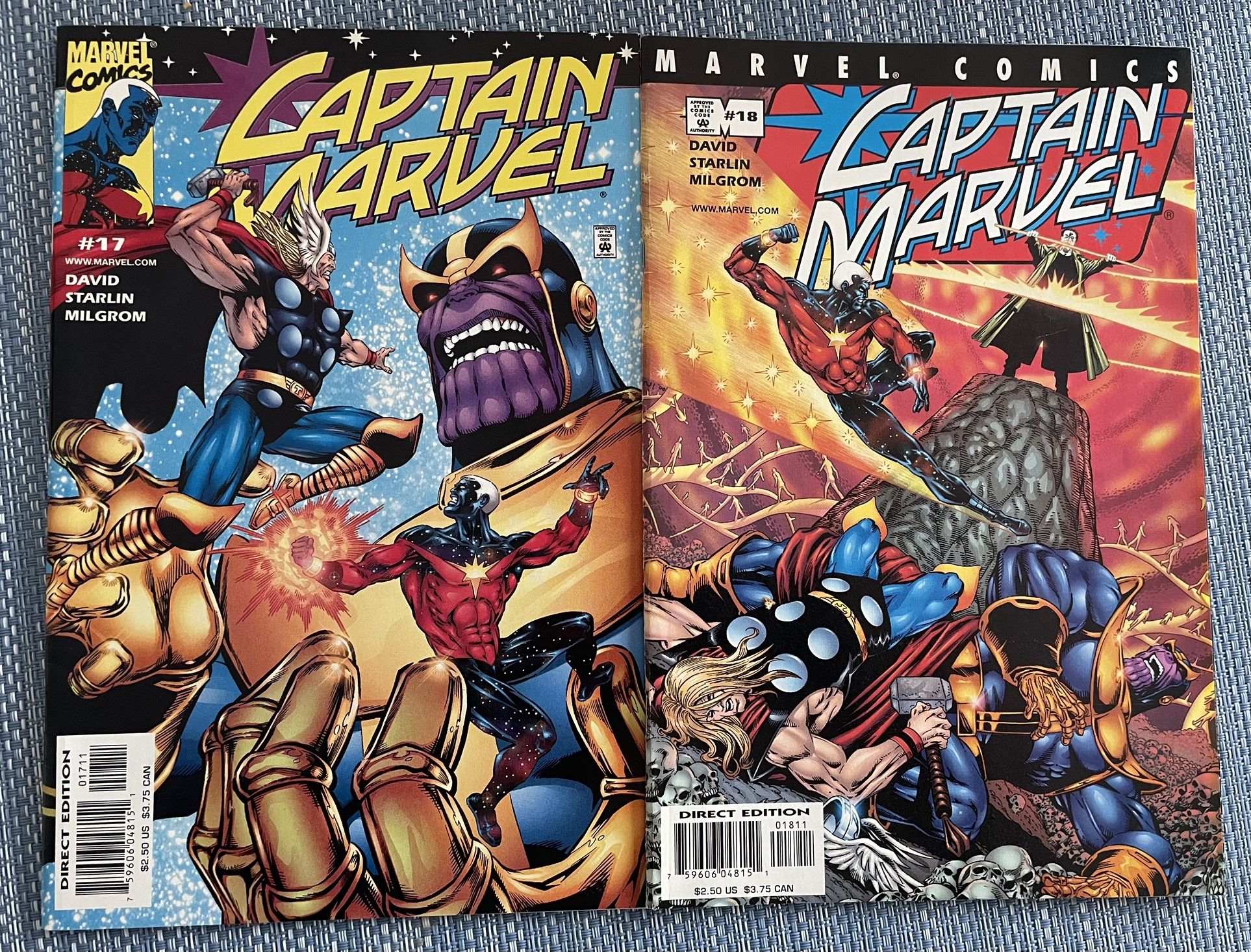 Two Captain Marvel Comics