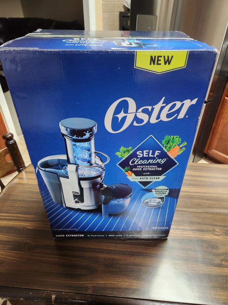 New in box Oster 1000-Watt 40 oz. Black/Silver Self-Cleaning Professional Juice Extractor with Auto-Clean Technology