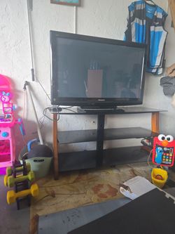 TV stand and 40 in Panasonic TV