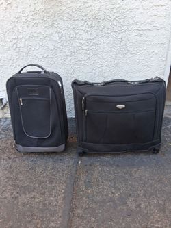 2 rolling suitcases with pull up bars $25  for both pickup 3-8:30 pm rainbow/charleston cash only read description