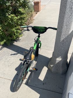 Boys green bike