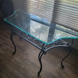 Solid wrought iron glass top table.