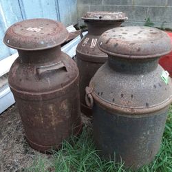 Antique metal milk jug with lid