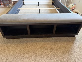 Hyndell Queen Upholstered Panel Bed in Dark Espresso Brown