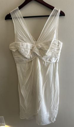 Donna Ricco Twist Bodice Silk Chiffon Size 12 Ivory med knee length. Or My wardrobe has only been worn by me… no one else!!!   Fabric Type Chiffon Sea