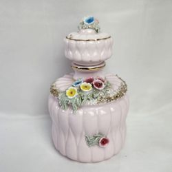 Vintage Pink Ceramic Vanity Decanter Multi Flower Spaghetti Trim Quilted Design. Decanter measures 6" high 