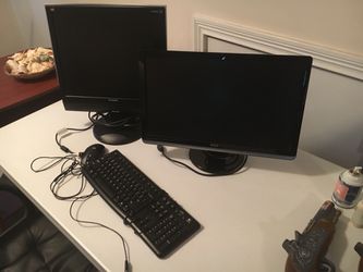 Computer equipment. Two monitors, mouse and keyboard
