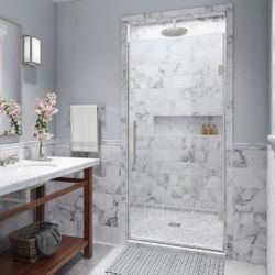 Seamless designwork and high end customization encompass the Nautis Completley Frameless Hinged Shower Door Collection. Standing 80 inches in height, 