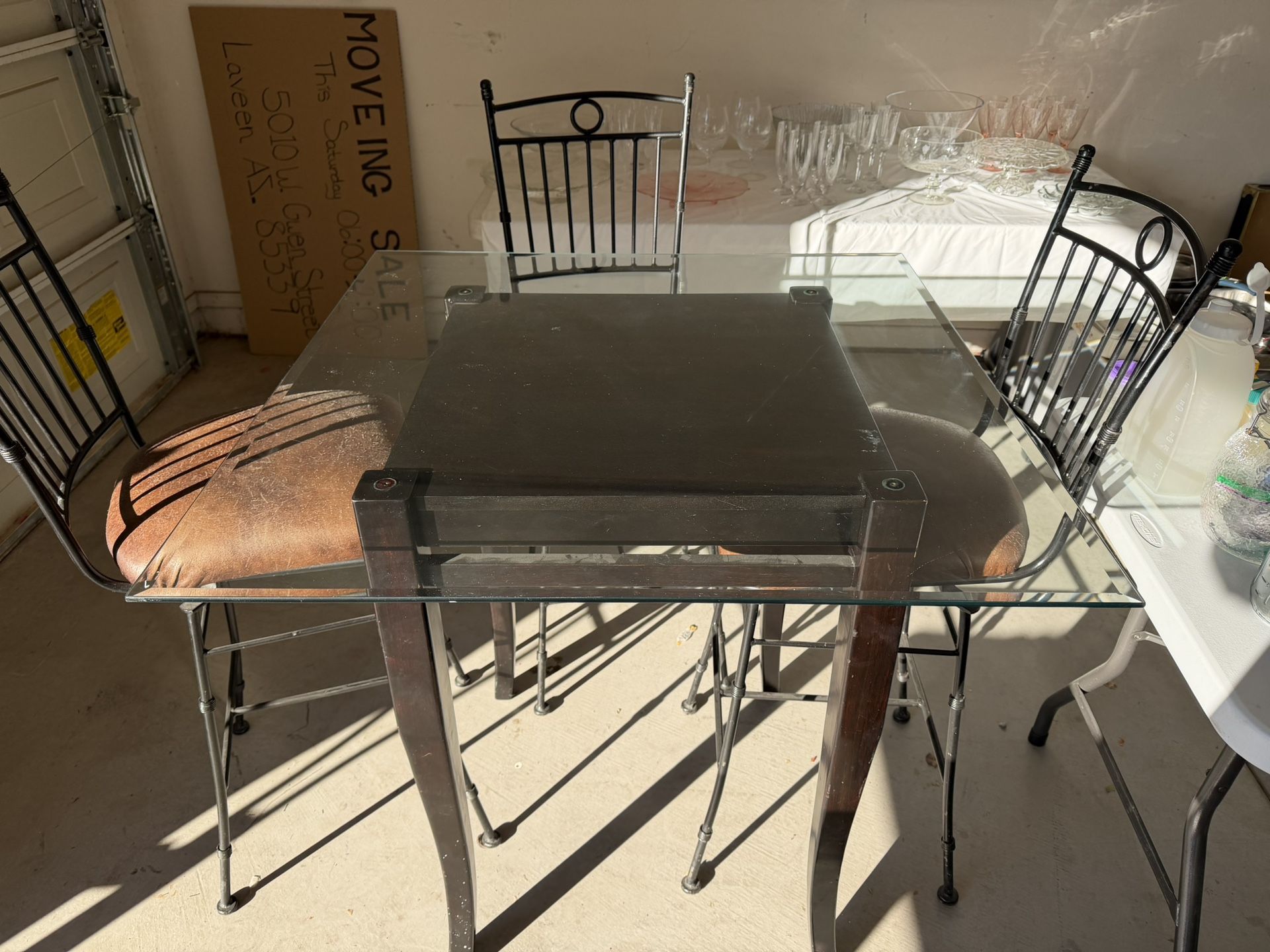 Bistro Table With Leather Covered Chairs