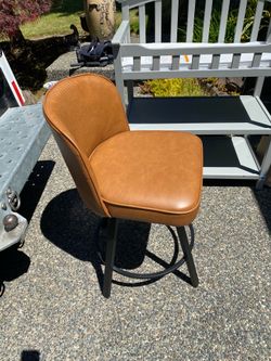 Brown swiveling chair.