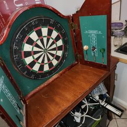 Classic bar style dart board and cabinet.