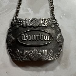 VTG Bacchus Pewter Bourbon Bottle Decanter Hanging Tag Label Chain USA 2.25” Wid   Add a touch of vintage charm to your home bar with this Bacchus Pew