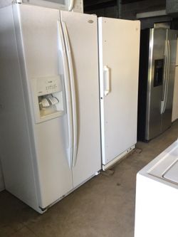 White side by side Whirlpool refrigerator/ one year warranty/ delivery and installation are available