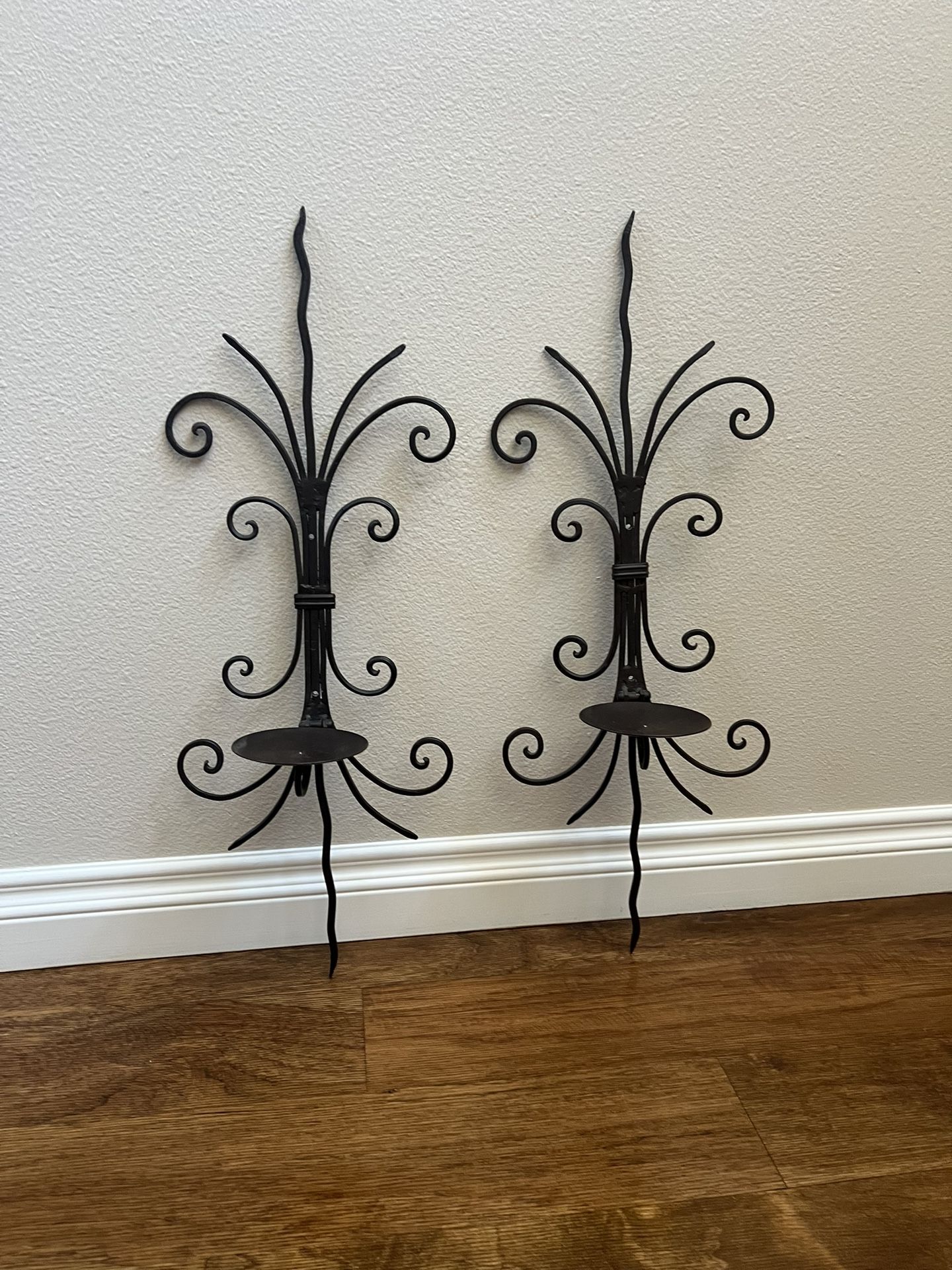 Pair of antique bronze wall candle holders