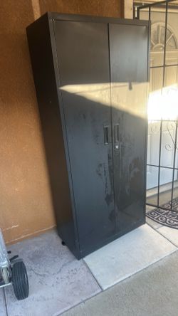 Black metal storage cabinet $125