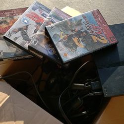 Playstation 2 with games & 3 controlers (make offer)