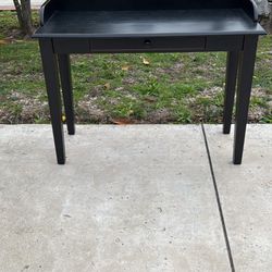 Pier 1 Imports desk. 1 drawer in front of black with rim. 42” length x 30” tall x 18” depth