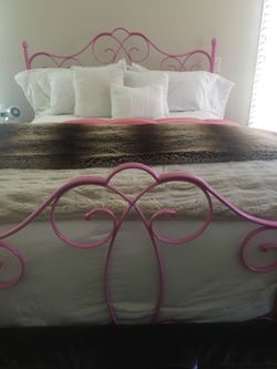 Pottery barn kids queen size pink bed.