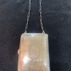 3x3.5. With chain 9.5 long. Sterling antique purse, change carrier. Original mirror.  69.00 Johanna at Antiques and More. Located at 316b Main Street 