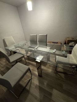 Modern glass donning table with 6 chairs