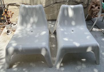 2 white IKEA outdoor chairs