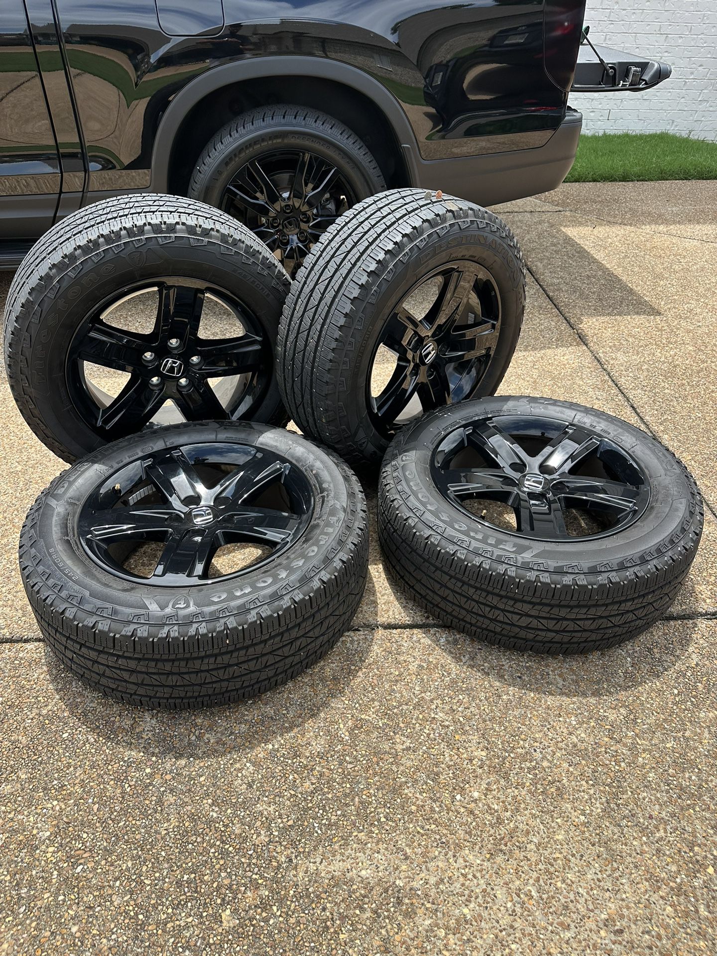 A set of Honda Ridgeline Black Edition Wheels And Tires