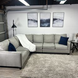 Free delivery Ashley Furniture beige L shaped sectional couch retails $1600