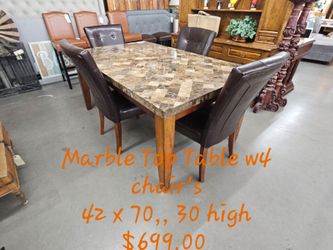 Dining Table W4 Chairs marble top We are located at 2811 East Bell road. Another Time Around Furniture.