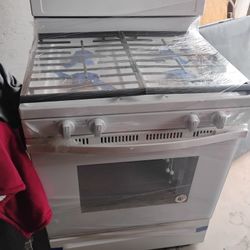 WHIRLPOOL GAS  STOVE , SOME SCRATCHES BU NOT BAD