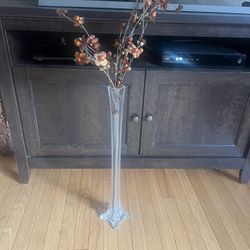 thin tall glass vase with orange brown flowers 35” tall p/u Jamison, PA