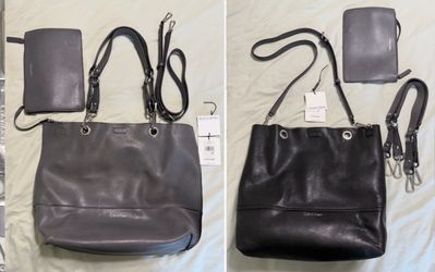 Brand new ( tag was cut off) Calvin Klein reversible tote bag with matching zip pouch.