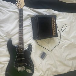 beginner guitar and amp with new strings