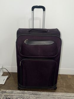 Large purple soft side checked suitcase