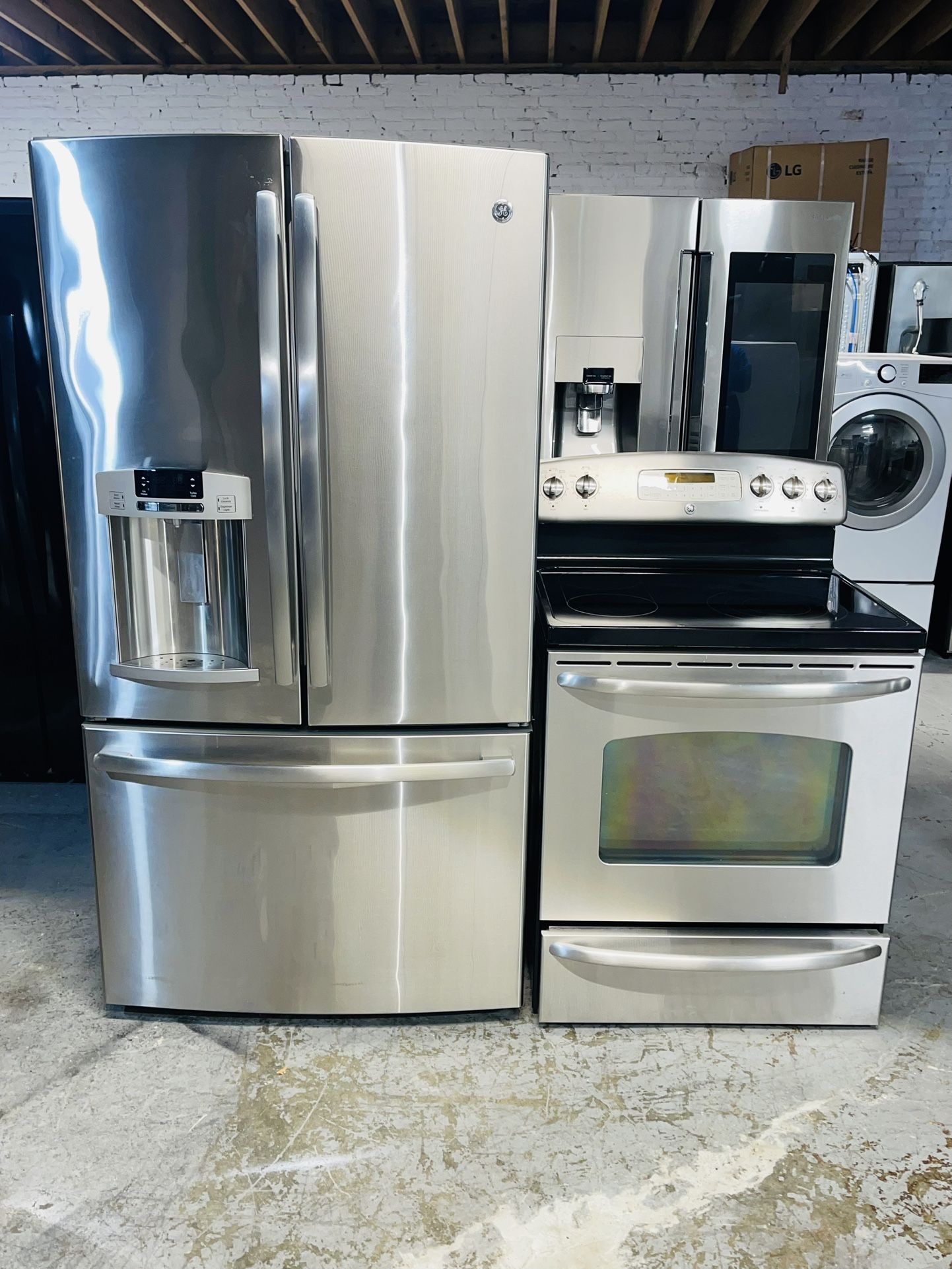 GE refrigerator 36X69X29 and electric stove. Stainless steel. Includes a receipt for a 90-day warranty.s