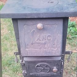 Lang Antique Cast Iron Warming Stove from the Late 1800s with damper