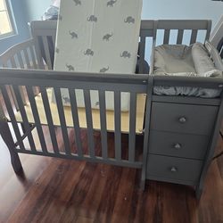 Never used ** Gray Mini crib with changing table