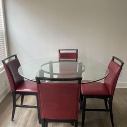 Glass Table With Four Red Leather Chairs 