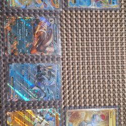 6 Pokemon Cards and 65 pack sleeves
