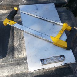 Hacksaw And Contractors Clipboard 