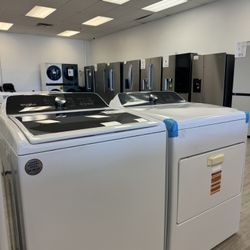 Whirlpool Top Load Washer And Front Load Electric Dryer In White 