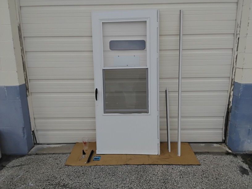 Nice White Storm Door With Screen Right Hand Swing 36" X 80" Very Clean Like New.