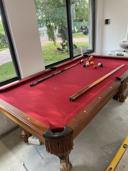 POOL TABLE WITH STICKS AND BALLS
