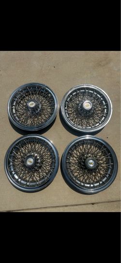 Four Chevy caprice hubcaps