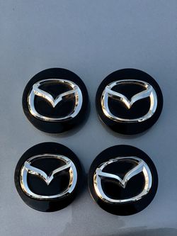 Mazda 56mm center caps,genuine Mazda item
