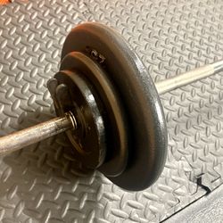 48 inches Steel Standard Barbell W/Weight Plates: 25s, 10s and 5s ponders. 93 # Brute W.